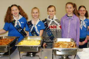 A girls group serves up breakfast