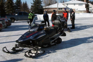 A close up of a black snowmobile
